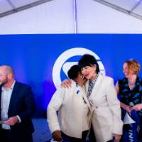 President Mantella giving hug to event guest